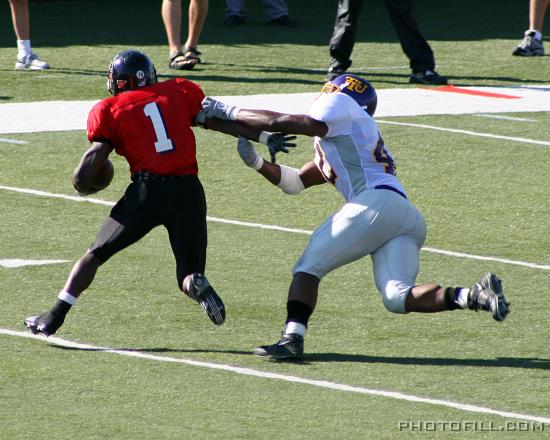 IMG_5101 #1 Garrett Wolfe pushes away tacklers